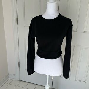 Cropped black jersey top. Size small. Never worn.